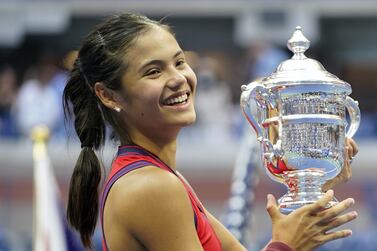 Great Britain's Emma Raducanu holds the trophy as she celebrates winning the women's singles final on day twelve of the US Open at the USTA Billie Jean King National Tennis Center, Flushing Meadows- Corona Park, New York. Picture date: Saturday September 11, 2021.