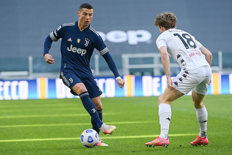 Juventus' Cristiano Ronaldo, left, takes on Benevento's Daam Foulon in Turin on Sunday. AP