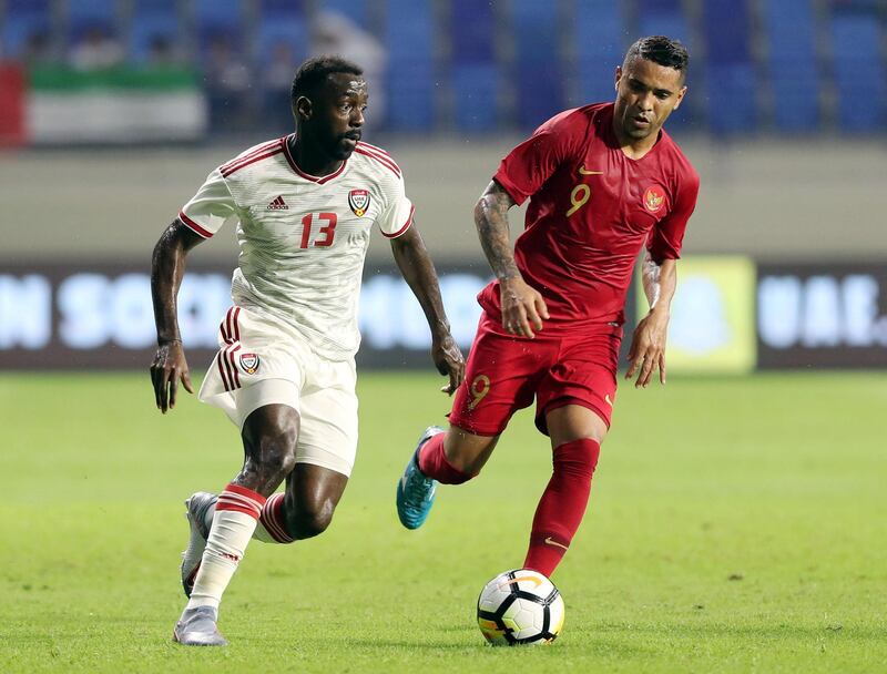 Dubai, United Arab Emirates - October 10, 2019: Ahmed Barman of the UAE and Alberto Goncalves of Indonesia during the Qatar 2022 world cup qualifier between The UAE and Indonesia. Thursday 10th of October. Al Maktoum Stadium, Dubai. Chris Whiteoak / The National