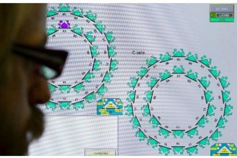 A monitor tracks high-energy collisions between two microscopic beams of particles in the Large Hadron Collider near Geneva. A team from the centre that houses the collider has detected particles travelling faster than the speed of light - a finding that appears certain to be proved wrong within a year. Fabrice Coffrini / AFP