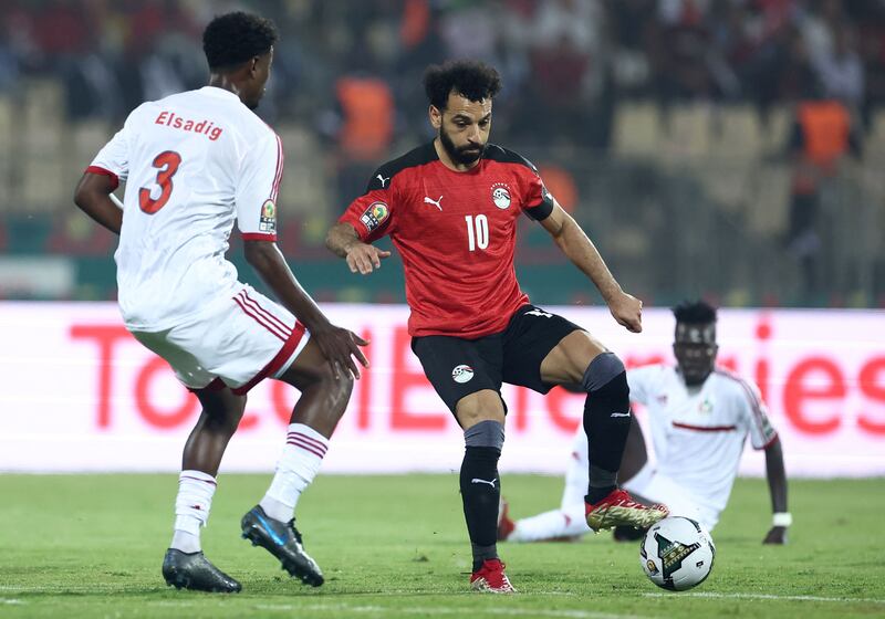 Egypt's forward Mohamed Salah challenges Sudan's defender Elsadig Hassan. AFP