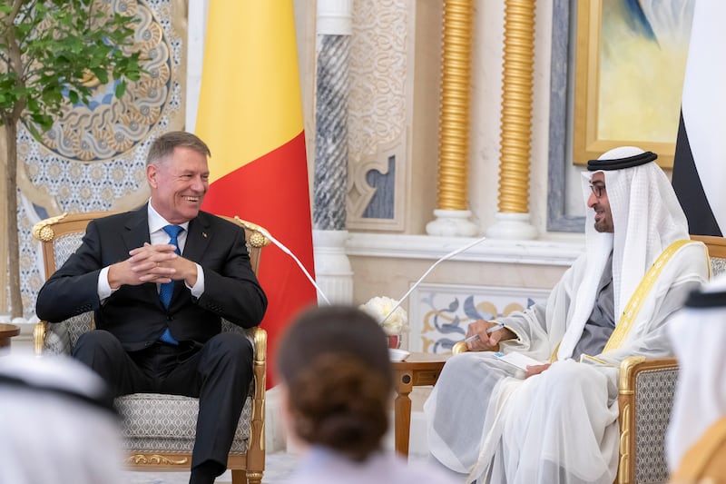 The President and Mr Iohannis share a light-hearted moment during talks at Qasr Al Watan. Mohamed Al Hammadi / UAE Presidential Court