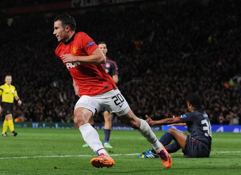 Manchester United striker Robin van Persie celebrates scoring the second goal of the match during Wednesday's Champions League win over Olympiakos. Peter Powell / EPA / March 19, 2014