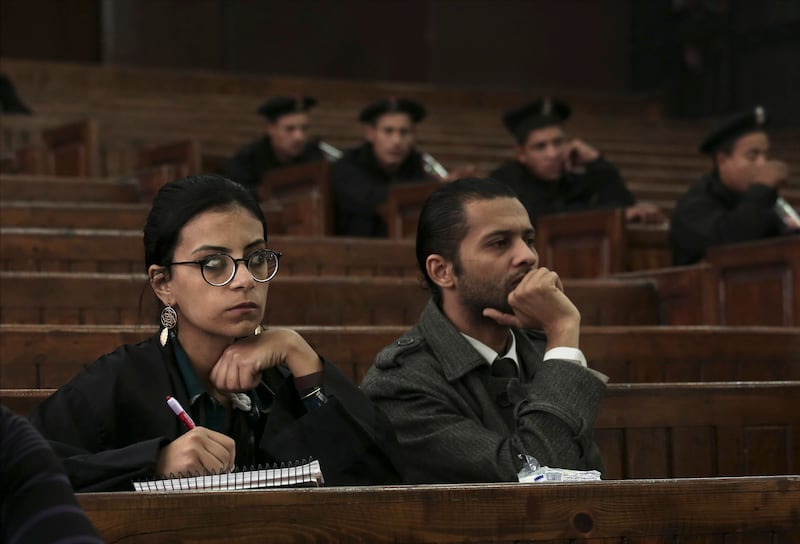 Mahienour El Masry, left, a prominent activist and rights lawyer, takes notes during a 2014 trial in Cairo. AP