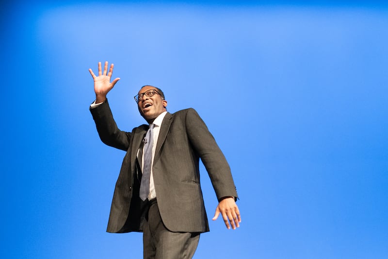 Mr Kwarteng leaves the stage after delivering his keynote speech to party members at the annual Conservative Party conference in Birmingham. PA