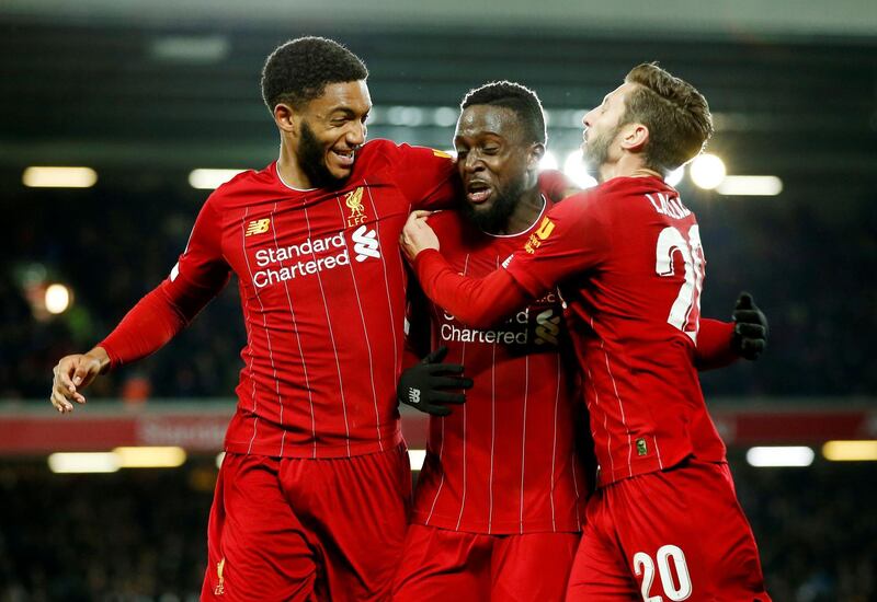 Liverpool's Divock Origi, centre, celebrates scoring their fifth goal. Reuters