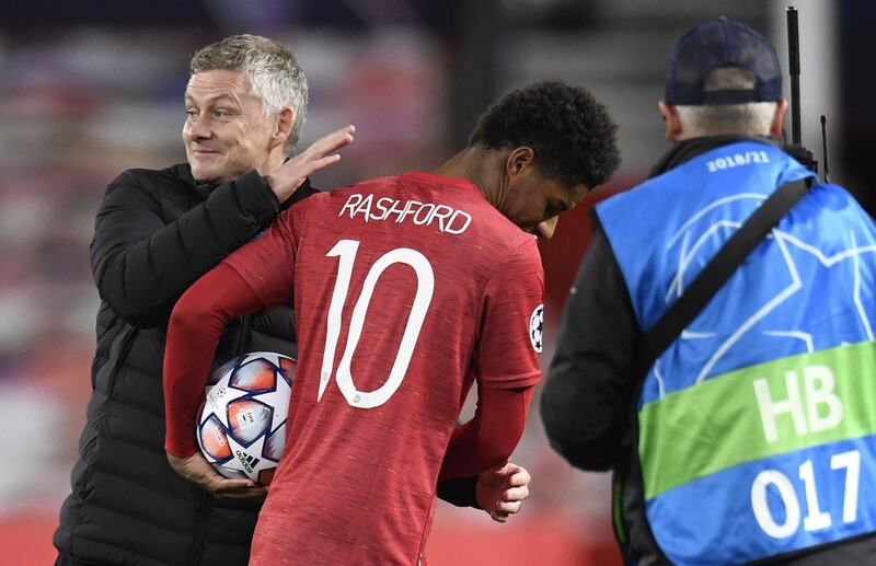Marcus Rashford  is congratulated by Manchester United manager Ole Gunnar Solskjaer after his hat-trick against  Leipzig. EPA