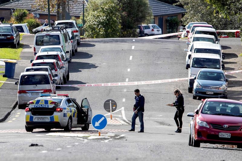 Police officers cordon off an area after a shooting incident in a residential neighbourhood in Auckland. AFP
