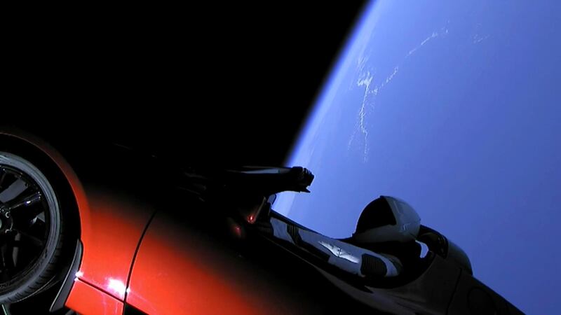 This image from video provided by SpaceX shows the company's spacesuit in Elon Musk's red Tesla sports car which was launched into space during the first test flight of the Falcon Heavy rocket on Tuesday, Feb. 6, 2018. (SpaceX via AP)