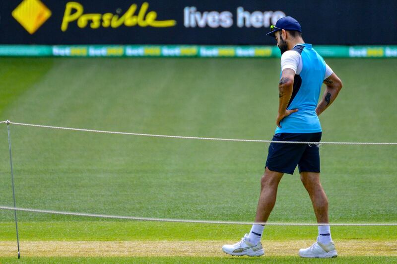 Virat Kohli inspects the Adelaide pitch. AFP