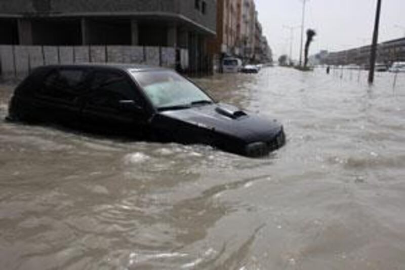 Traffic tries to make its way through heavy flooding on the 311 in Sharjah.