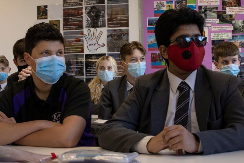 Pupils arrive for their first lessons on their first day back from lockdown at Chertsey High School. Getty Images