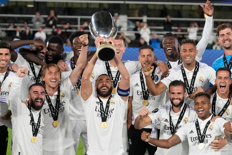 Real Madrid's Karim Benzema lifts the trophy after winning the Uefa Super Cup final. AP Photo