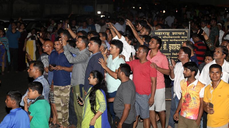 People gather to get a glimpse of late Indian actress Sridevi Kapoor's mortal remains arriving at an airport in Mumbai. Divyakant Solanki / EPA