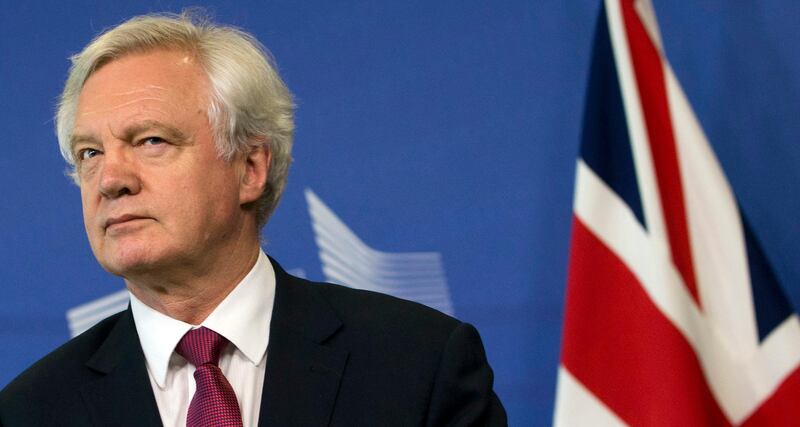 FILE -In this Monday June 19, 2017 file photo, British Secretary of State for Exiting the EU David Davis listens to opening remarks during his arrival at EU headquarters in Brussels. U.K. and European Union negotiators should be able to move from talks about Britainâ€™s divorce terms to negotiating future relations before the end of the year, the top U.K. Brexit official said Tuesday, July 11, 2017. (AP Photo/Virginia Mayo, File)