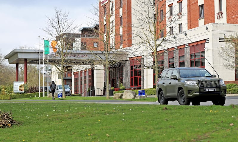 Irish Army personnel leave the Crowne Plaza hotel after assisting in the transfer of airline passengers. Getty Images