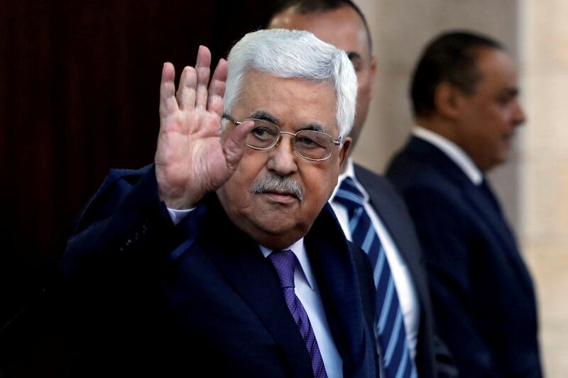 FILE PHOTO - Palestinian President Mahmoud Abbas waves in Ramallah, in the occupied West Bank May 1, 2018. REUTERS/Mohamad Torokman/File Photo