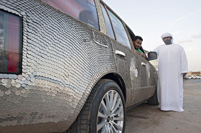 More than 60,000 coins adorn this luxury SUV, collected by the brothers Ali and Ahmed Al Showaihi in every GCC country. Jeff Topping / For The National