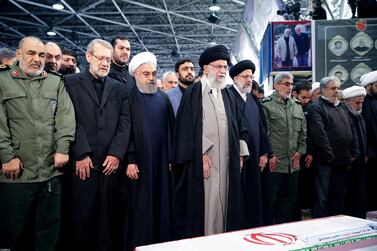Iran's supreme leader Ayatollah Ali Khamenei and president Hassan Rouhani pray near the coffin of Qassem Suleimani in Tehran. Reuters