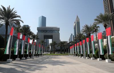 UAE flags at the DIFC area on UAE's 51st National Day in Dubai. Pawan Singh / The National