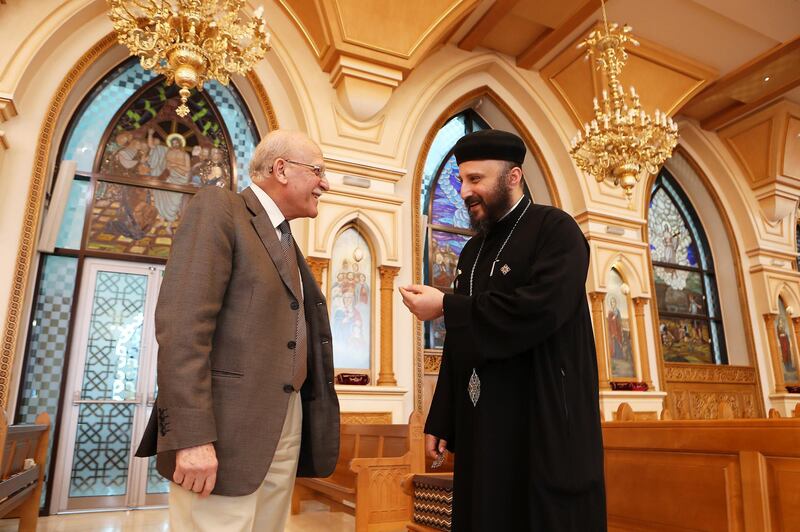 Maher Lamie and Father Bishoy at St Anthony’s Church in Abu Dhabi. Pawan Singh / The National