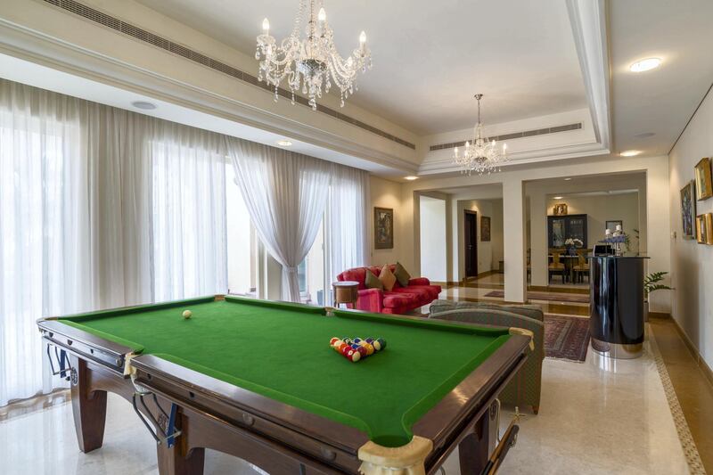 If there's not enough time for golf, a game of pool may do. Courtesy LuxuryProperty.com
