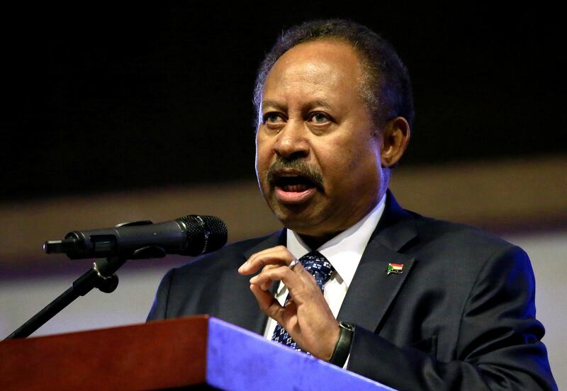 FILE PHOTO: Sudan's Prime Minister in the transitional government Abdalla Hamdok addresses people as they celebrate the first anniversary of the start of the uprising that toppled long-time ruler Omar al-Bashir, at the Friendship Hall in Khartoum, Sudan December 25, 2019. Picture taken December 25, 2019. REUTERS/ Mohamed Nureldin Abdallah/File Photo