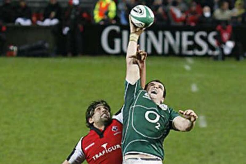Ireland's Eoin Reddan, right, wins a line out against Canada's Josh Jackson.