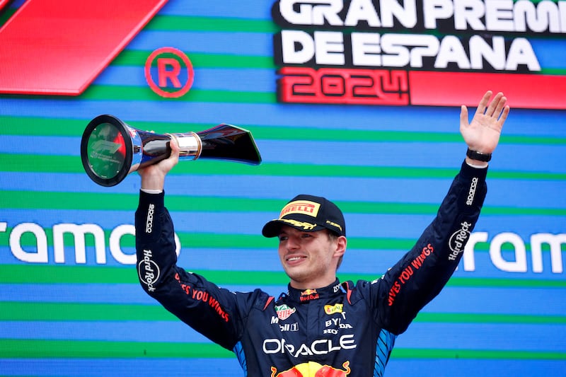 Red Bull's Max Verstappen celebrates on the podium after winning the Spanish Grand Prix at Circuit de Barcelona on June 23, 2024. Reuters
