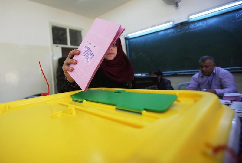 A Jordanian woman casts her vote at a polling station during parliamentary elections in Amman, Jordan last year. Photo by Jordan Pix/ Getty Images