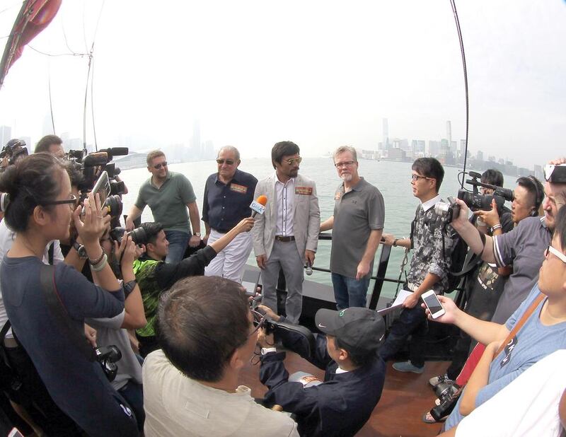 Manny Pacquiao, with trainer Freddie Roach and promoter Bob Arum tour Hong Kong last year as he promoted his November fight with Chris Algieri. Mike Young for The National / October 26, 2014