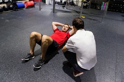 ABU DHABI, UNITED ARAB EMIRATES, 9 AUGUST 2017. 

 Steve Hamilton, Abu Dhabi Saracens player, training ahead of the new season, along with his physiotherapist,
Tim Fletcher.
(Photo by Reem Mohammed / The National)

Reporter: Paul Radley
Section: Sports