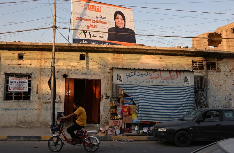 A banner for a candidate installed on a rooftop in Mosul. AFP