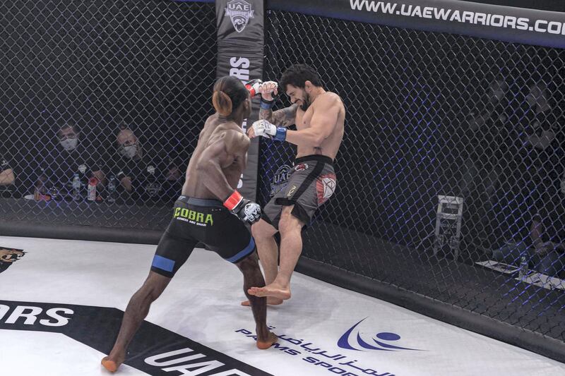 Jaures Dea of Cameroon lands a crushing blow at the Brazilian Andre Pinheiro. Courtesy UAE Warriors