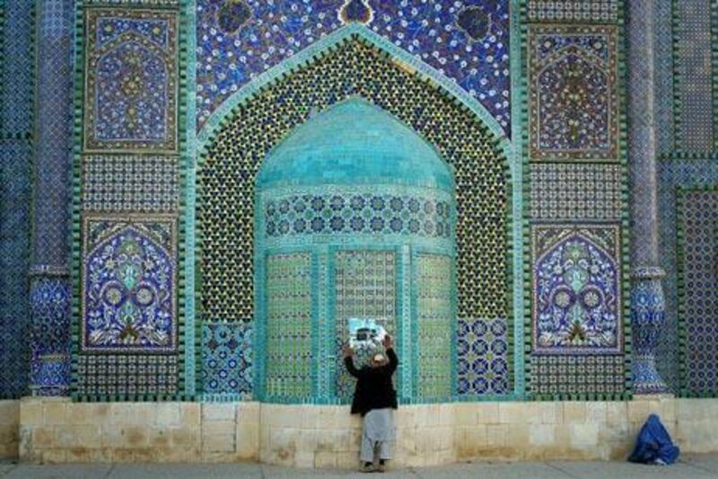 The peace in Mazar-e-Sharif, which houses the Blue Mosque, above, is being eroded by political and ethnic tensions.