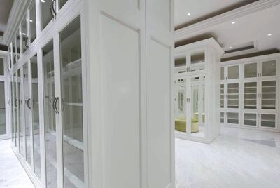 There's no shortage of hanging space in the master bedroom's sizeable mirrored dressing room. Courtesy The Agency