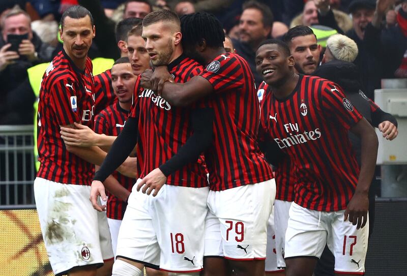 AC Milan players celebrate with Ante Rebic after he scored his second goal against Udinese. Getty Images
