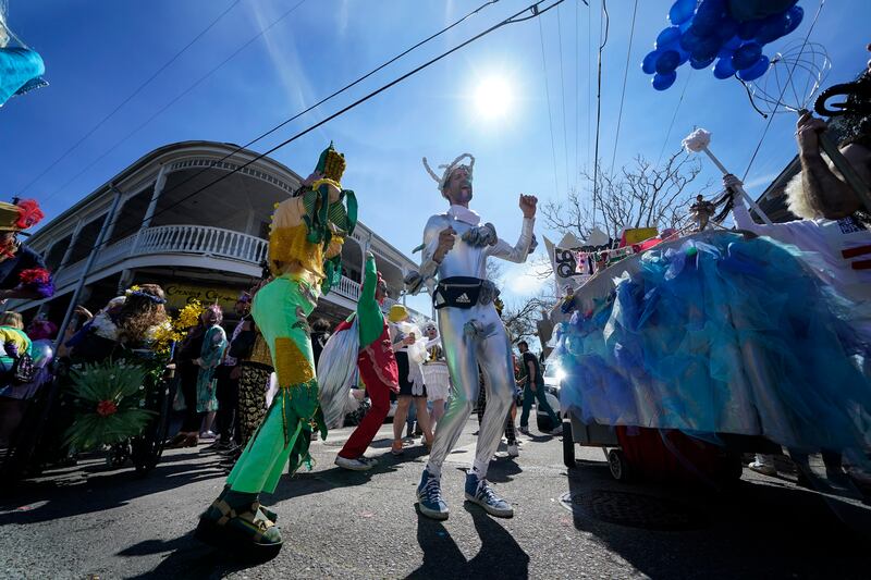 A person marches in the Societe de Sainte Anne parade during Mardi Gras in New Orleans. AP