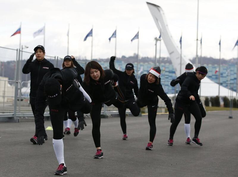 Players from the Japanese national women's ice hockey team take part in a training session near the Shayba Arena. Grigory Dukor / Reuters