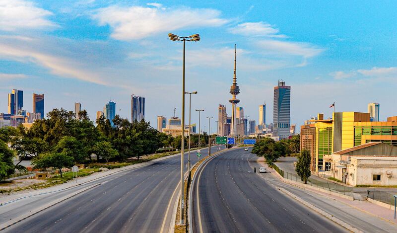 A view of an empty street with the Liberation Tower seen in the background, in Kuwait City.  EPA