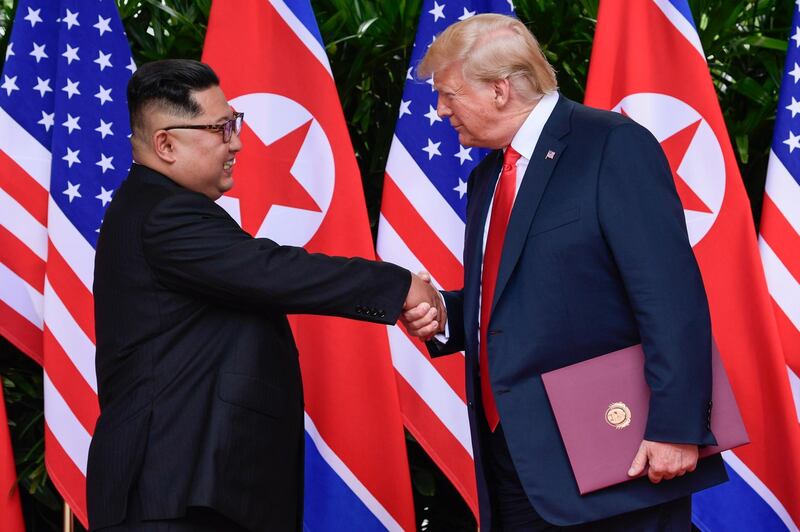 North Korea leader Kim Jong Un and U.S. President Donald Trump shake hands at the conclusion of their meetings at the Capella resort on Sentosa Island Tuesday, June 12, 2018 in Singapore. (AP Photo/Susan Walsh, Pool)