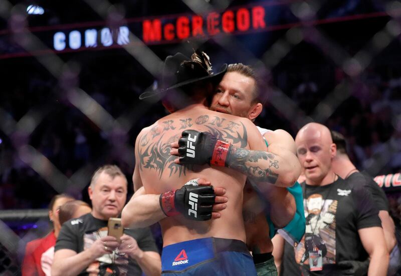LAS VEGAS, NEVADA - JANUARY 18: Conor McGregor hugs Donald Cerrone after his first round TKO victory in their welterweight bout during UFC246 at T-Mobile Arena on January 18, 2020 in Las Vegas, Nevada.   Steve Marcus/Getty Images/AFP