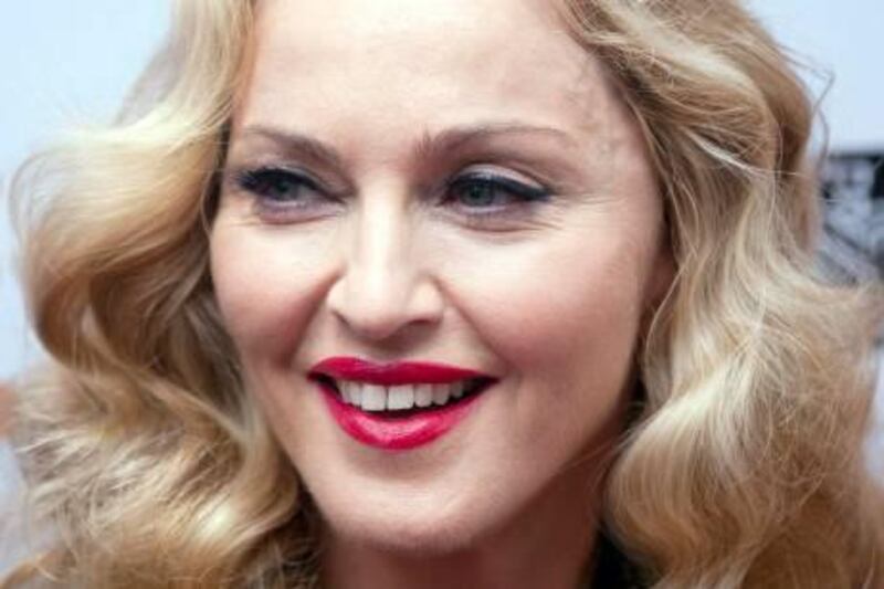 Director Madonna arrives on the red carpet for the film "W.E." during the 36th Toronto International Film Festival (TIFF) in Toronto September 12, 2011.    REUTERS/Mark Blinch (CANADA - Tags: ENTERTAINMENT) *** Local Caption ***  MDB15_FILM-TORONTO-_0912_11.JPG