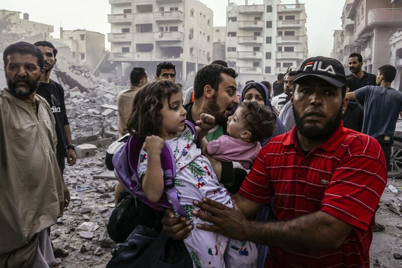 Palestinian families flee after an Israeli strike on Rafah in the southern Gaza Strip. AFP