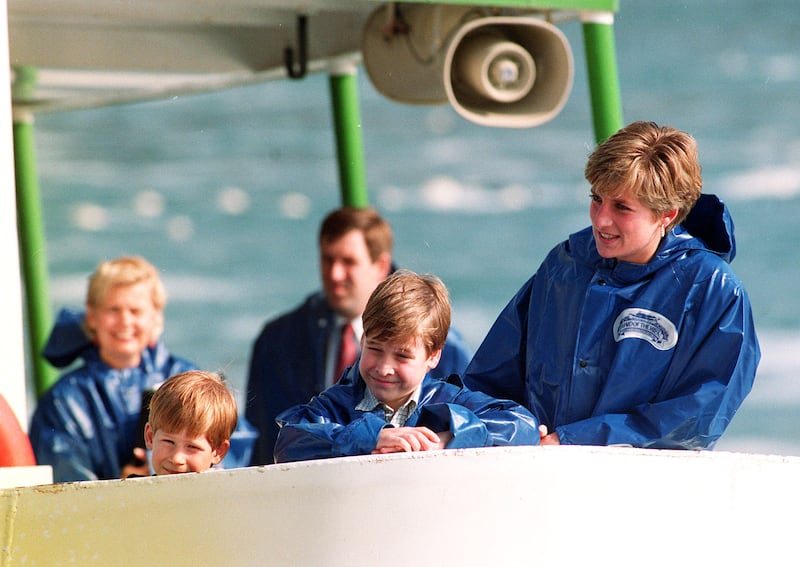 Princess Diana and her sons onboard the 'Maid of Mist' ship as they take a close look at the Niagara Falls, Canada, in 1991. PA