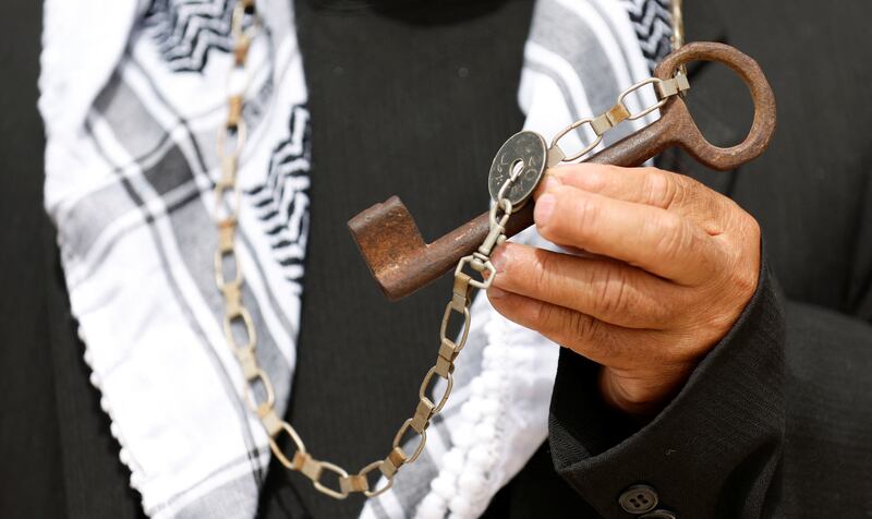 A Palestinian man at a Nakba rally in Ramallah holds a key to symbolise property lost during the forced removal of Palestinians from their homes after the formation of Israel. Reuters