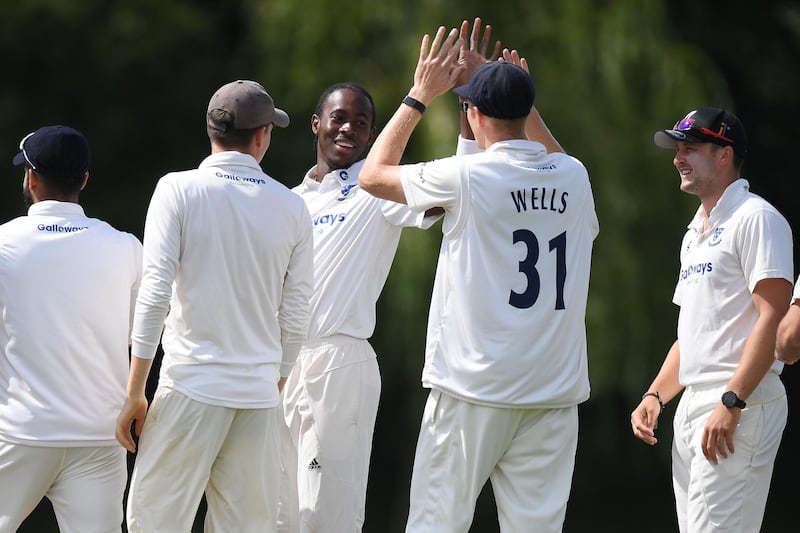Archer is congratulated on taking one of his wickets. Getty