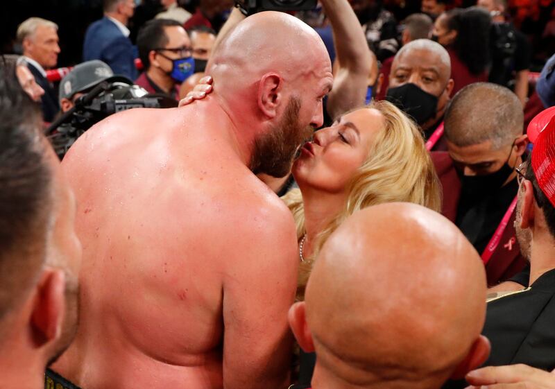 Tyson Fury celebrates with his wife Paris. Reuters