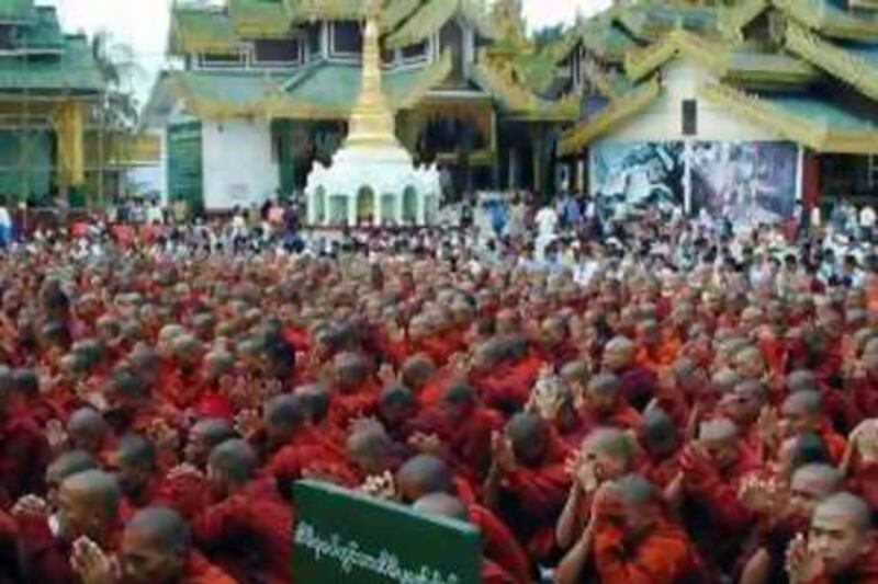 Myanmar Buddhist monks gather and pray at Shwedagon pagoda before taking up the street in a march protesting against the military government Monday, Sept. 24, 2007 in Yangon, Myanmar. Myanmar's religious affairs minister warns Buddhist clergy to restrain demonstrating monks, or else government will act on its own against the protesting clerics. As many as 100,000 anti-government protesters led by a phalanx of Buddhist monks marched Monday through Yangon, the largest crowd to demonstrate in Myanmar since a 1988 pro-democracy uprising that was brutally crushed by the military. (AP Photo)