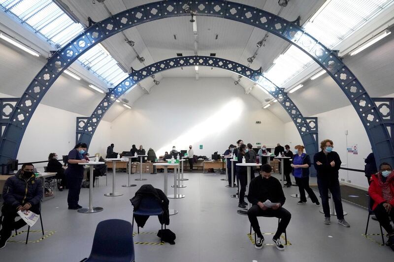 DUDLEY, ENGLAND - JANUARY 25: Heath workers queue for the Covid-19 vaccine before the general non-health-worker public are admitted later today in the Black Country Living Museum vaccination centre on January 25, 2021 in Dudley, England. The Black Country Living Museum was made famous as a set for the television show 'Peaky Blinders.' (Photo by Christopher Furlong/Getty Images)